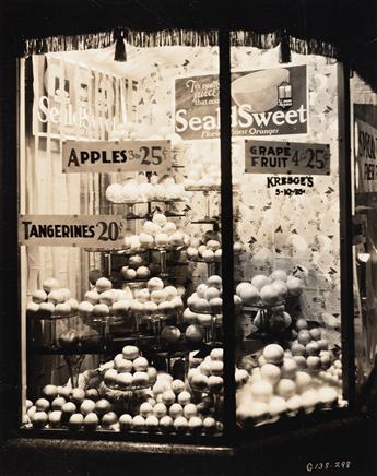 (ADVERTISING & STORE WINDOWS--FRUIT) A collection of 27 advertising and display photographs related to the Florida orange and citrus in